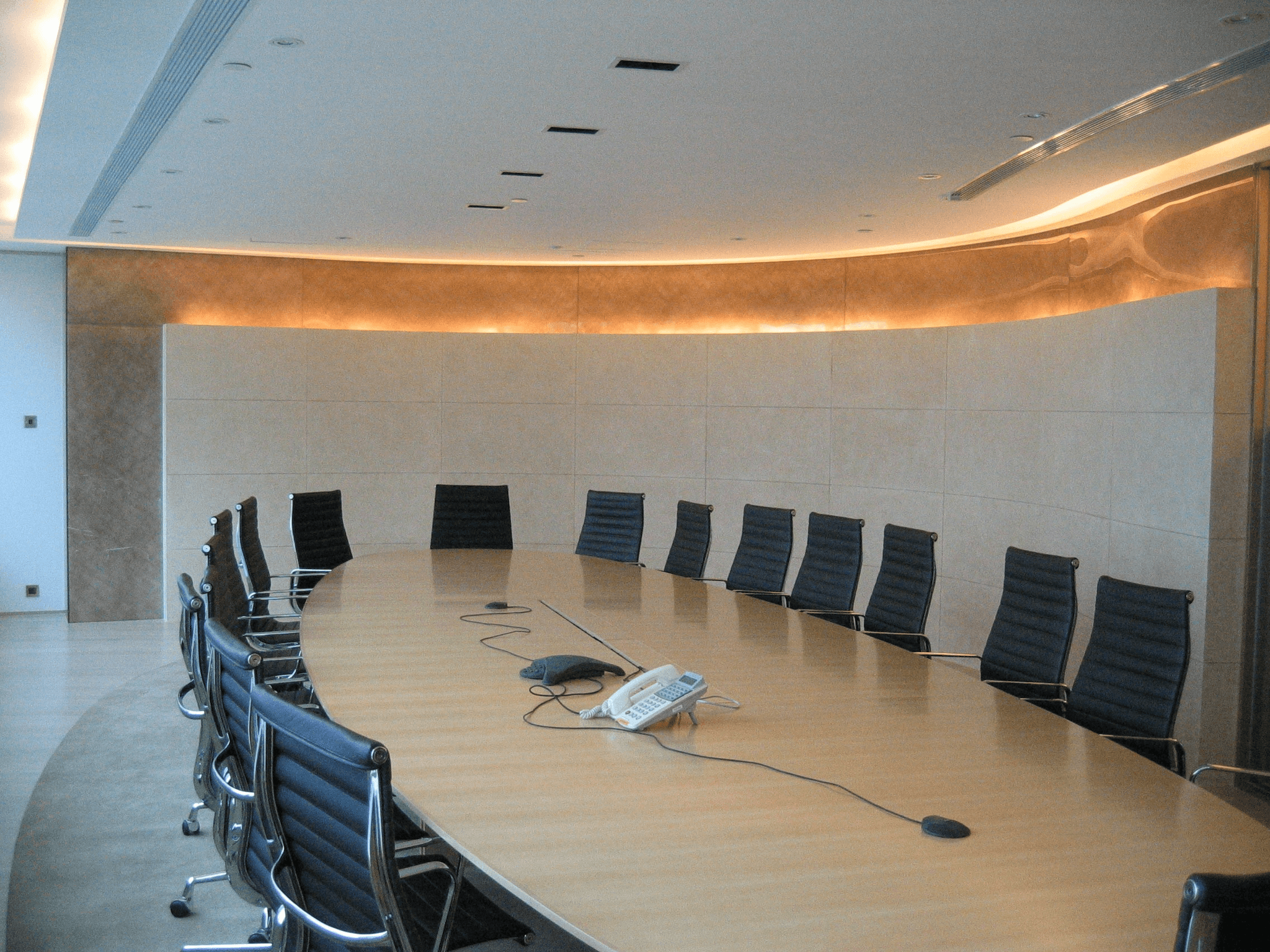 contemporary interior with seamless flat smooth ceiling, warm wood accents, serene atmosphere