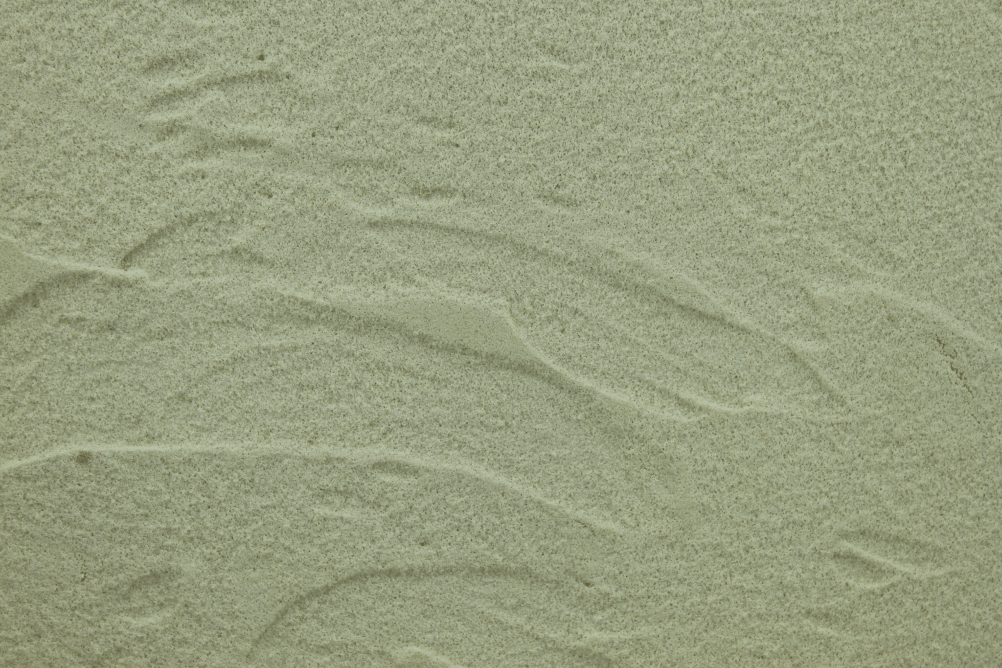macro texture of nordic blue italian aggregate plaster, cool slate blue mineral grains