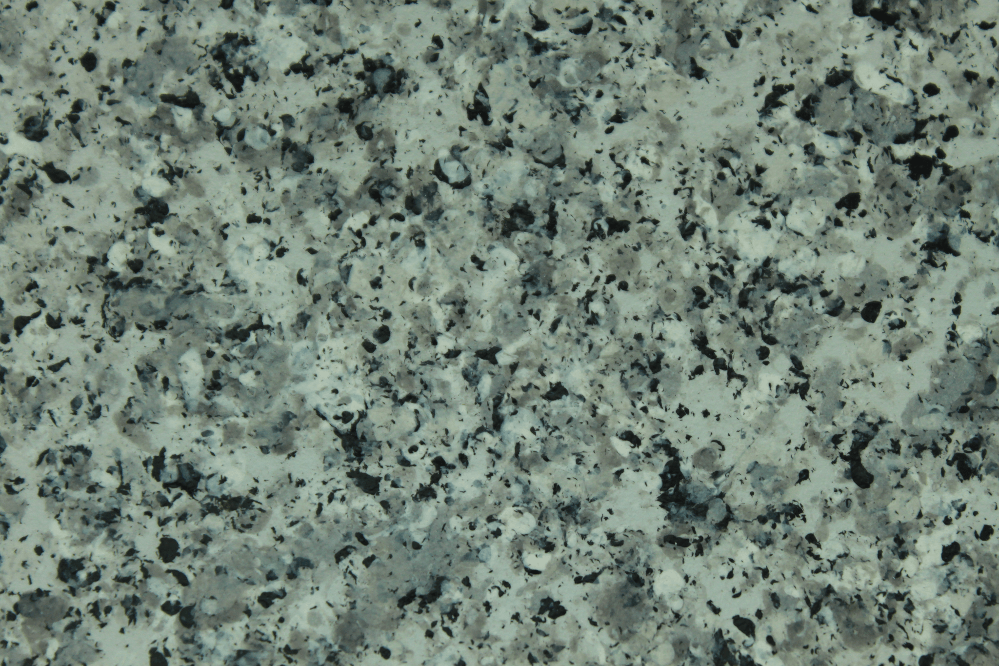 macro texture of dark grey granite finish with basalt flakes