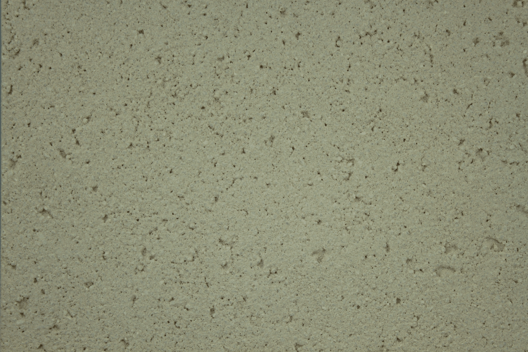 macro texture of warm beige mediterranean style aggregate plaster