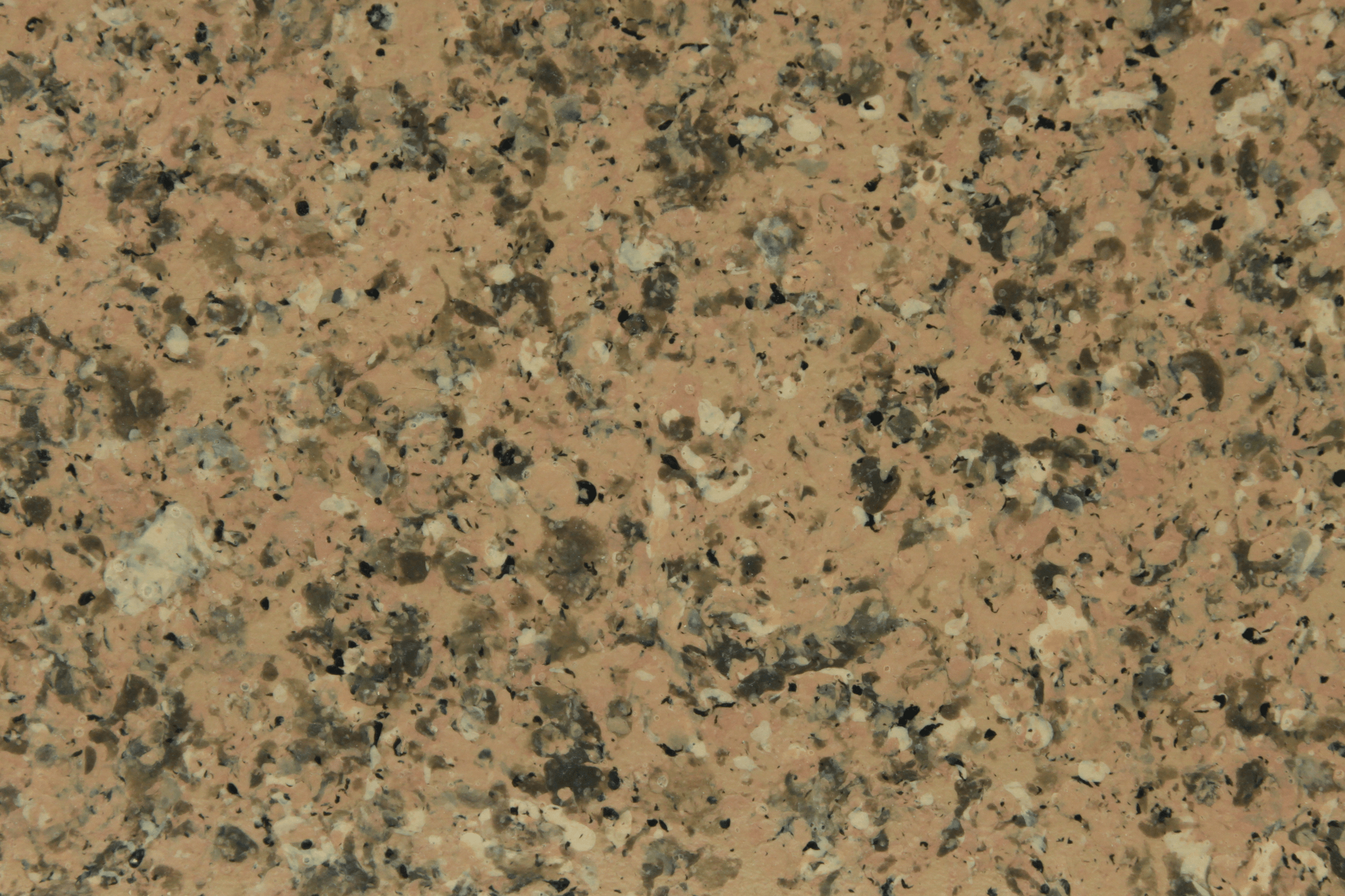 macro texture of sand colored granite finish with quartz grains