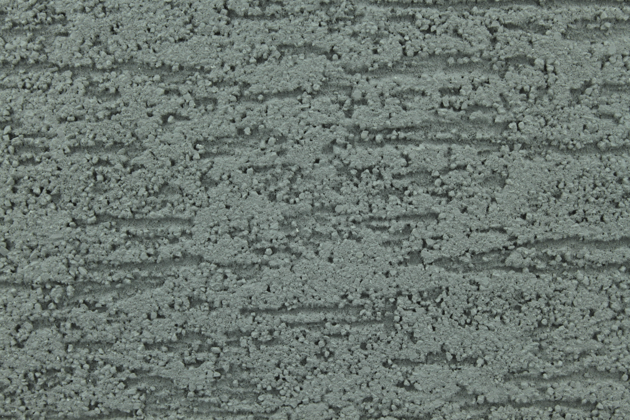 macro texture of light grey italian aggregate plaster with fine mineral grains