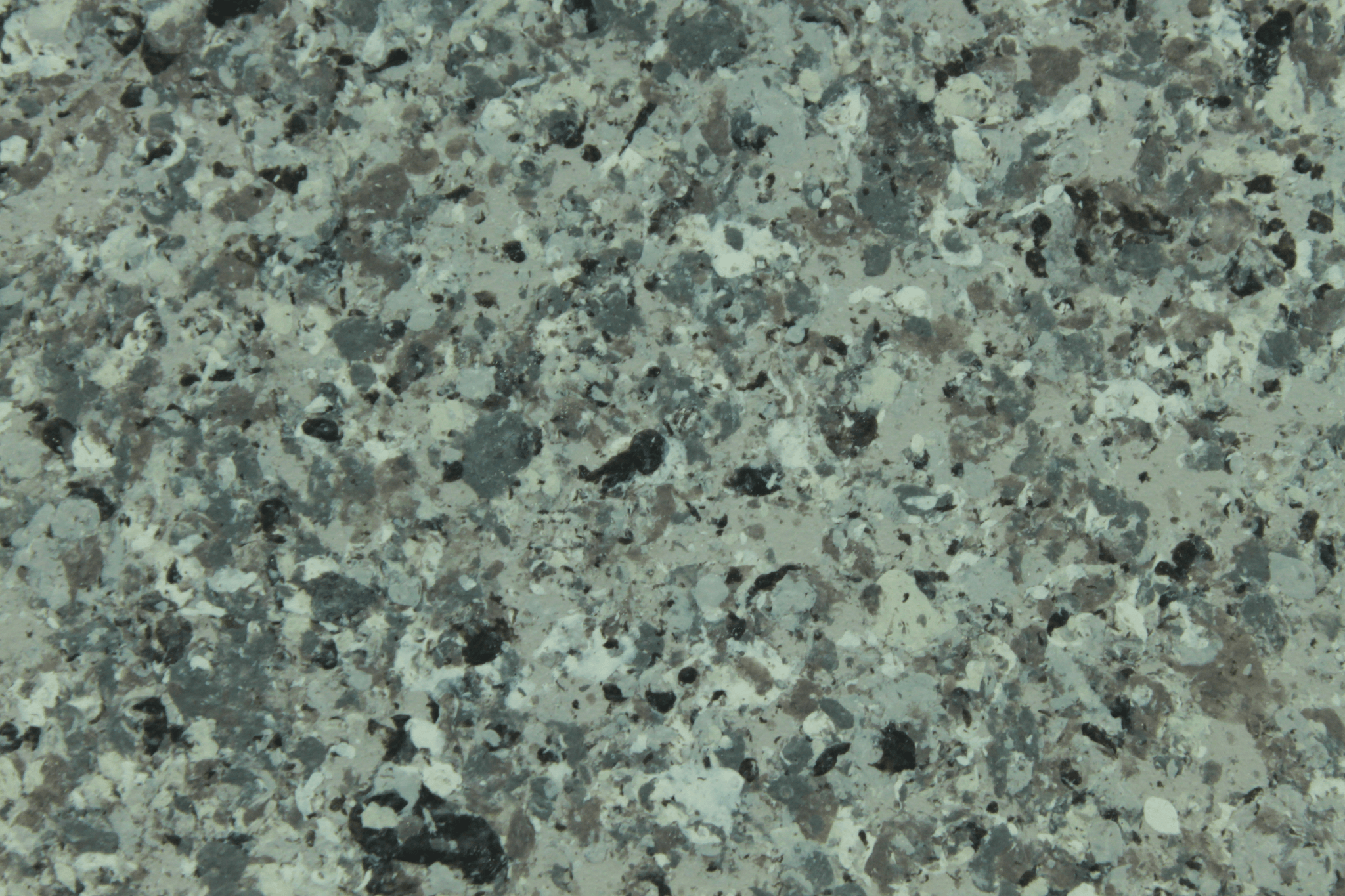macro texture of golden granite finish with amber flakes