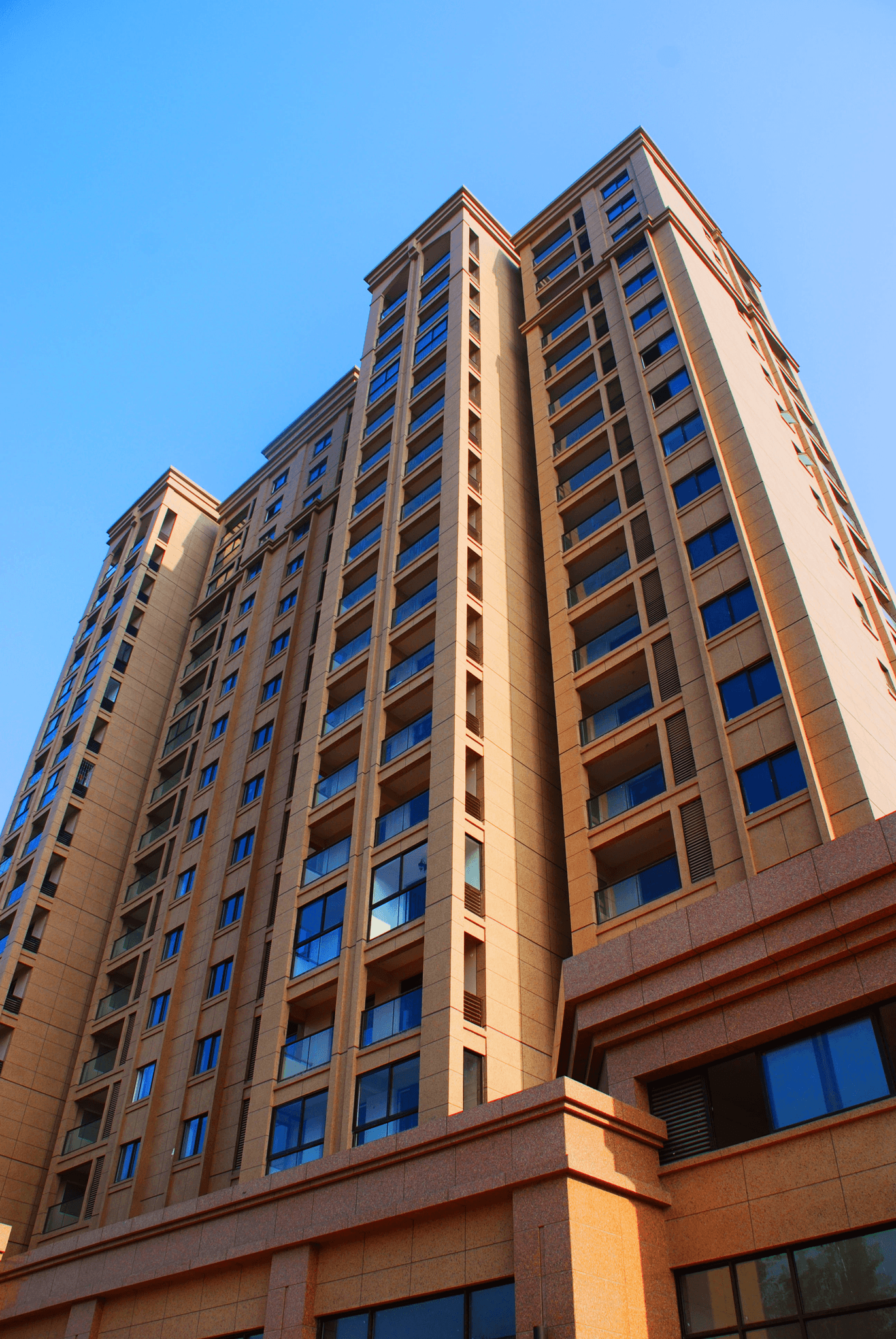 architectural detail of a building corner with premium granite finish, natural lighting