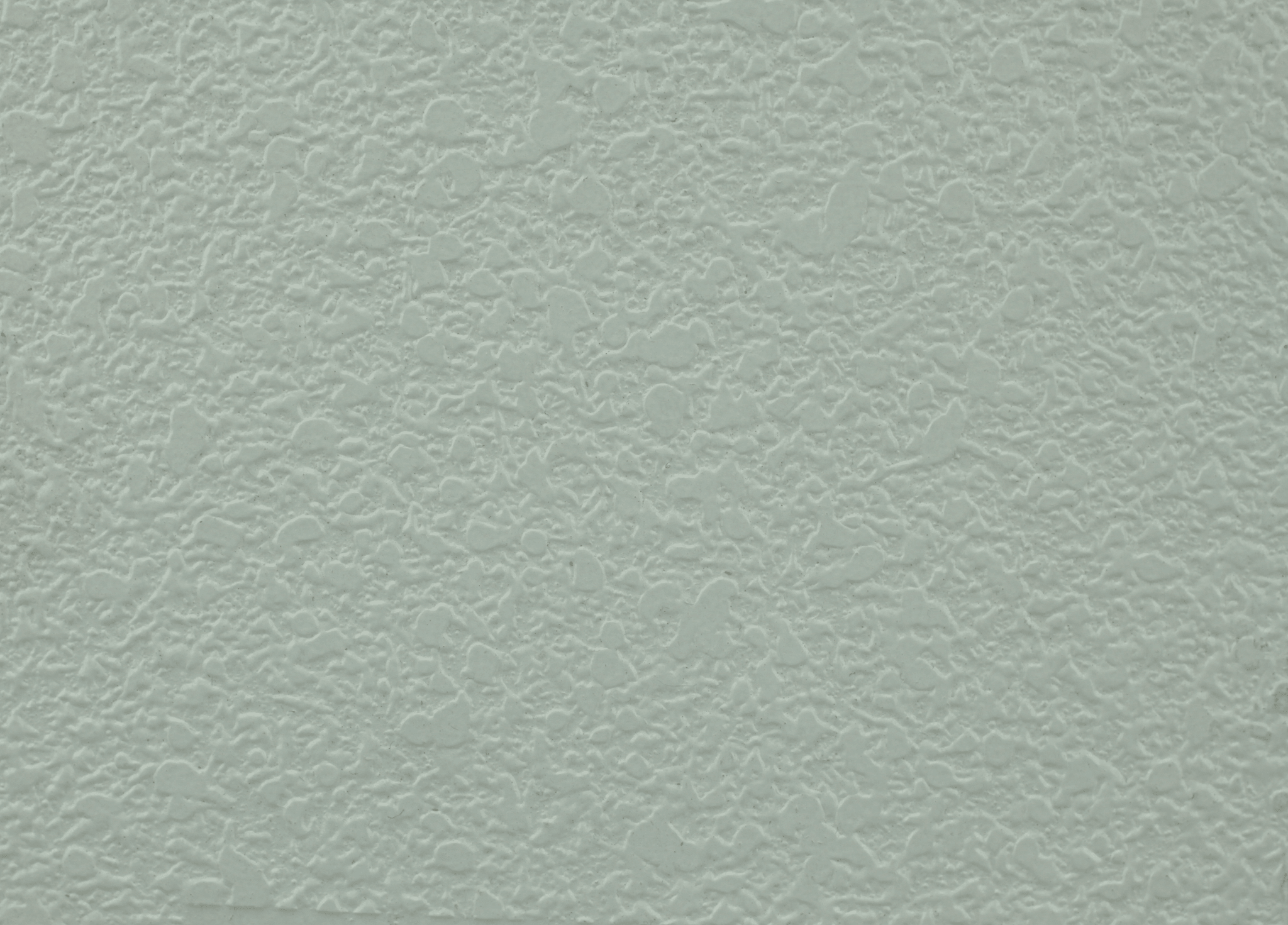 trowel application of texture coating on a wall surface, close up