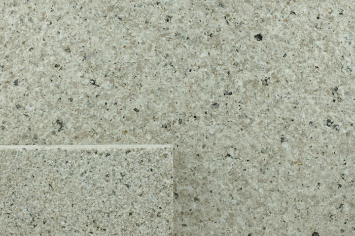 macro texture of silver grey granite finish with metallic mineral sparkles