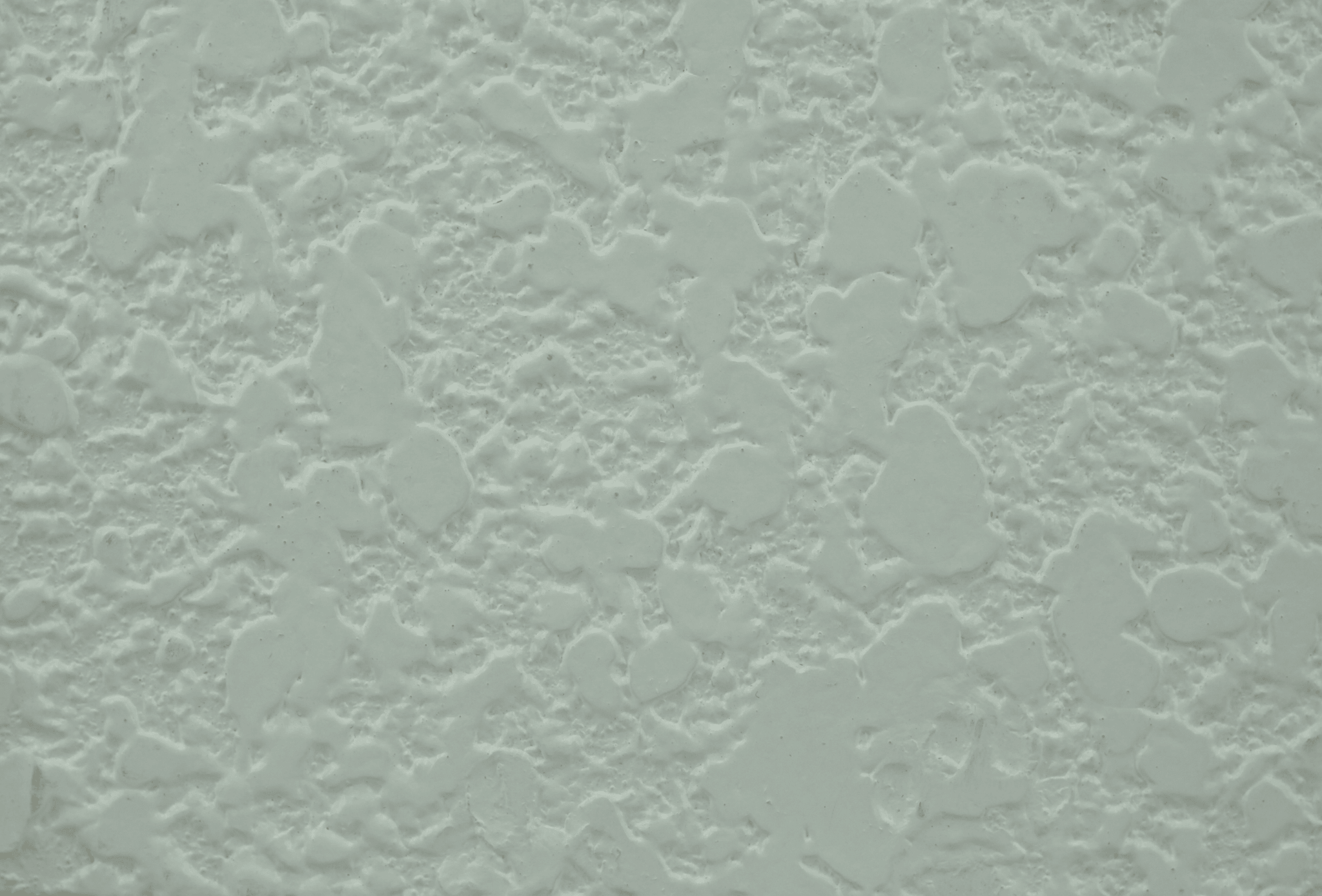 close up of warm sand textured coating on a contemporary wall facade